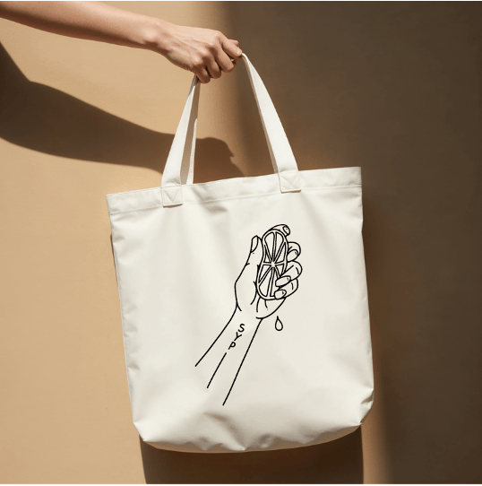 A proposed tote carrying a hand-drawn SYP artwork.